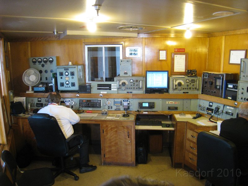 Queen Mary 2010 0340.JPG - The radio room was pretty active with two people working and a host at the door.